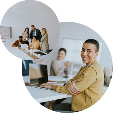 A female business analyst smiles as she uses her laptop to access business applications that use AI to better understand different data.