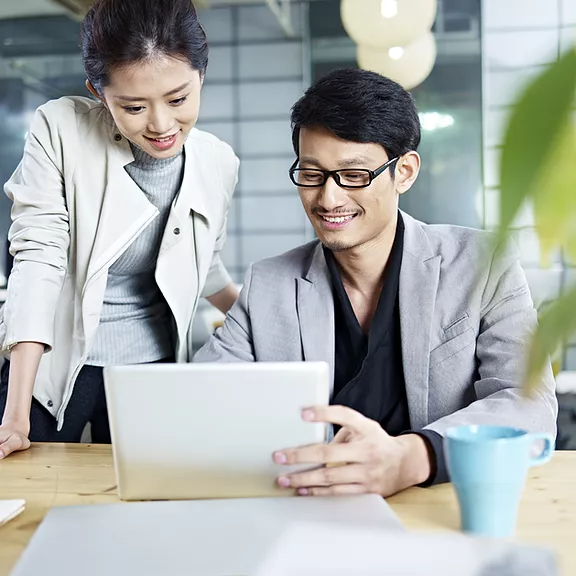 Picture of employee using Copilot to work alongside him, being embedded in the Microsoft 365 apps he uses every day — Word, Excel, PowerPoint, Outlook, Teams and more